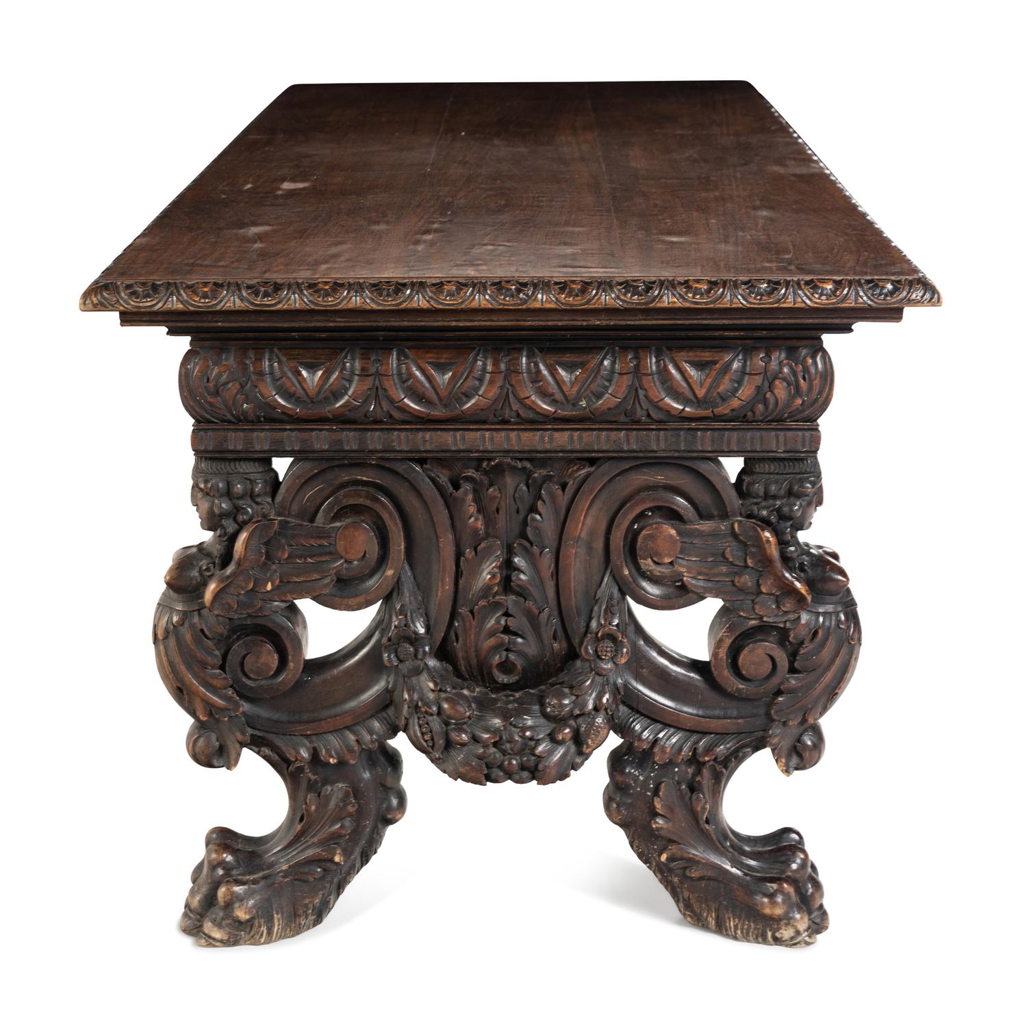 A Renaissance Revival Carved Walnut Trestle Table