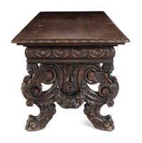 A Renaissance Revival Carved Walnut Trestle Table