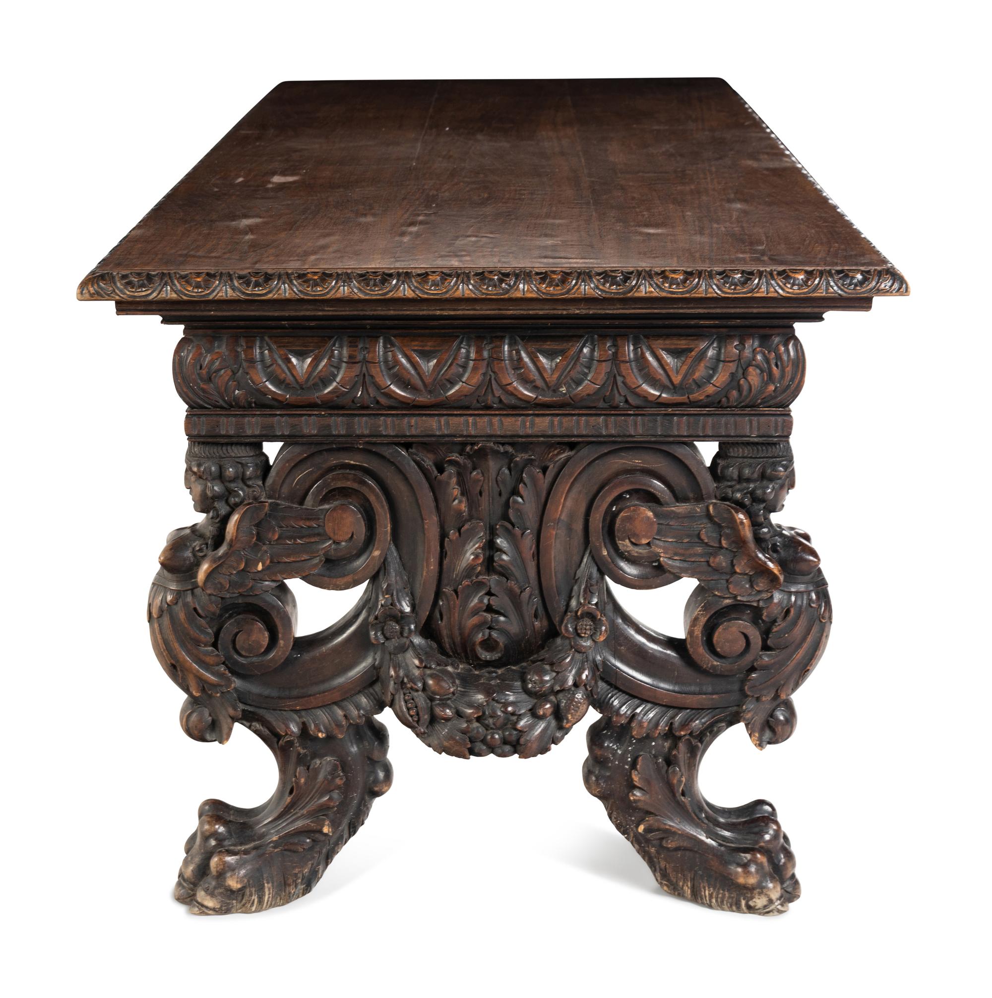 A Renaissance Revival Carved Walnut Trestle Table