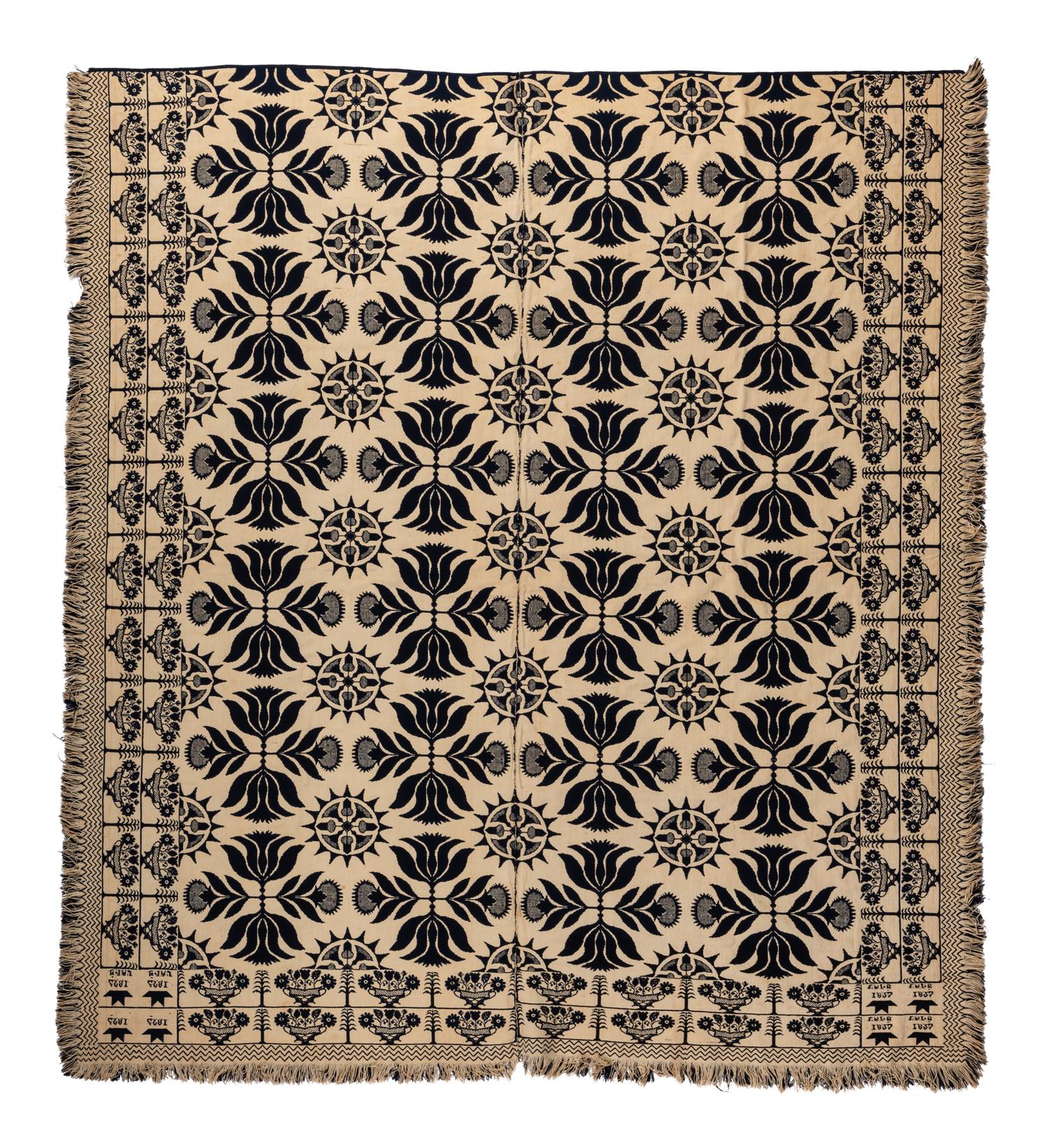 A Blue and White Flowering Urn, Sun and Acorn Pattern Jacquard Coverlet