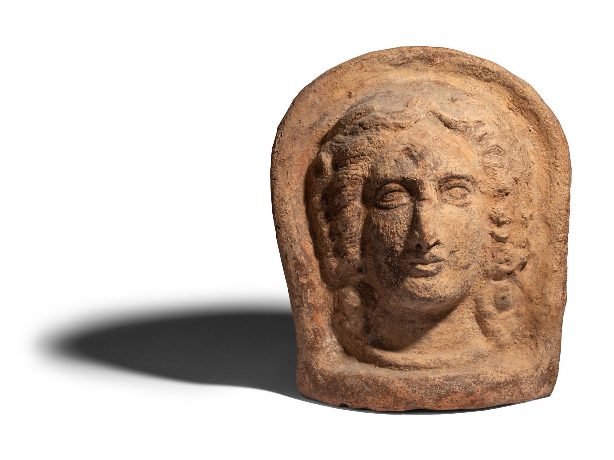 An Etruscan Terracotta Votive Head of a Woman