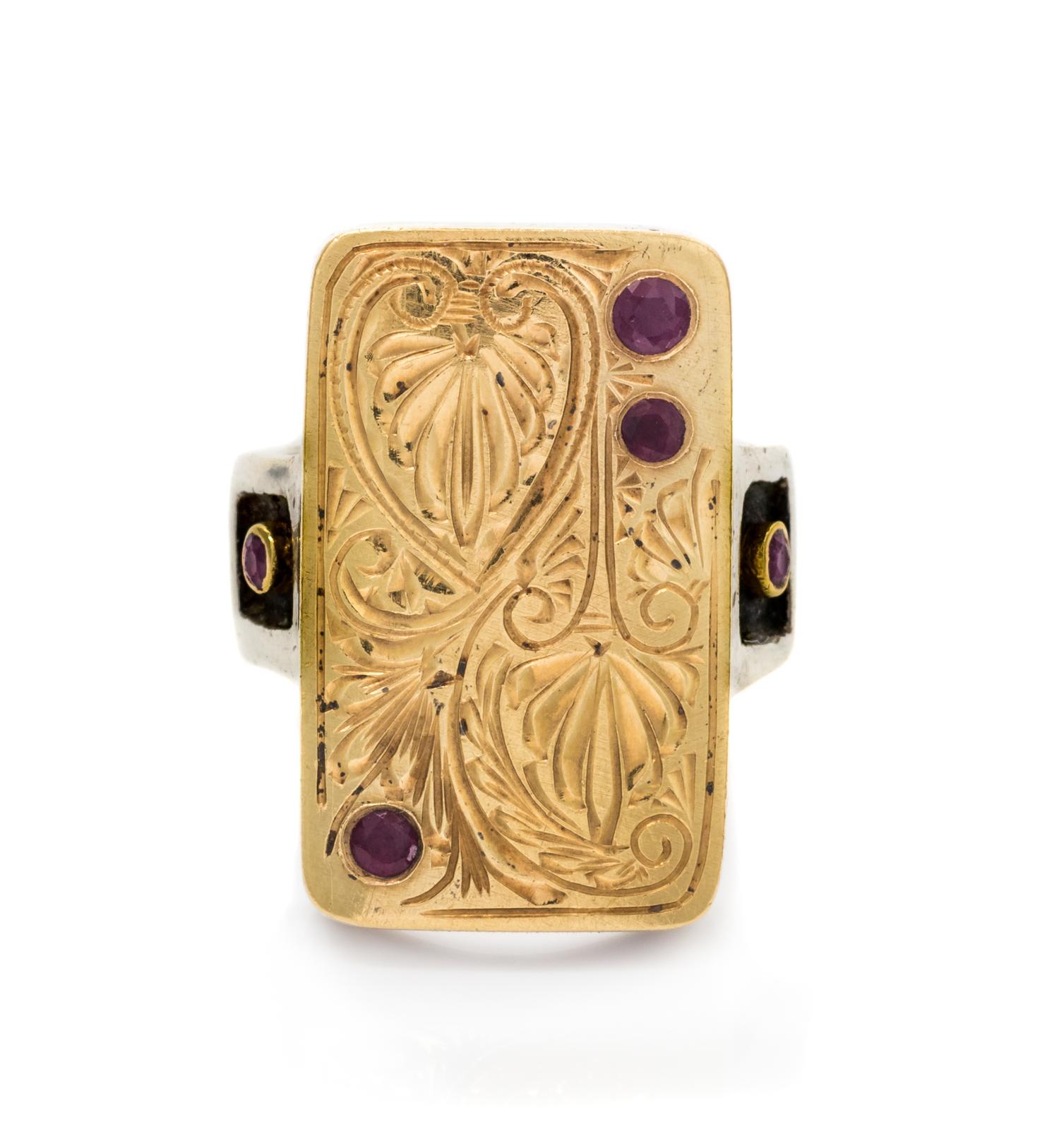 An 18 Karat Yellow Gold, Sterling Silver and Ruby Ring, 12.00 dwts.