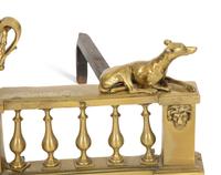 A Pair of French Brass Chenets with Recumbent Dogs