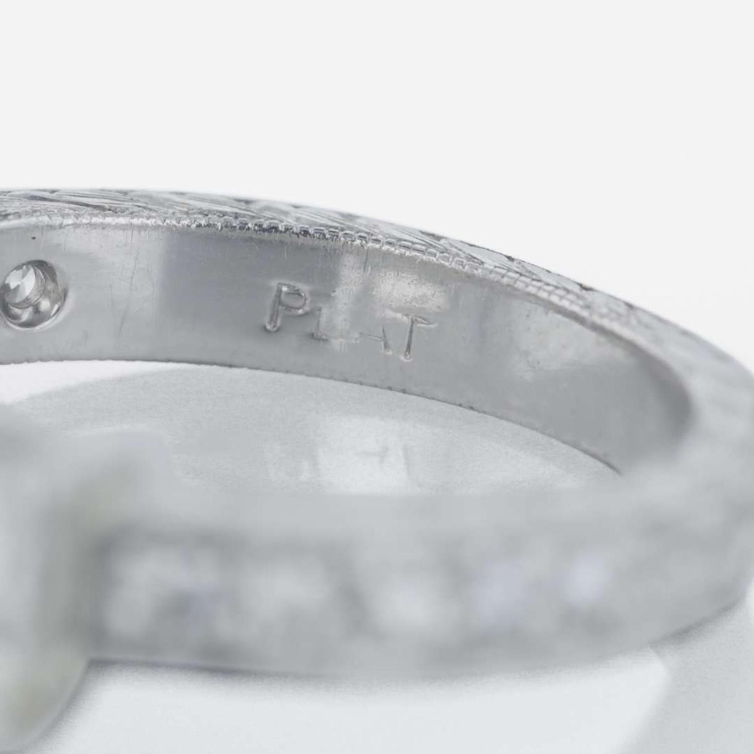 A platinum and diamond ring