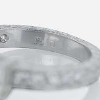 A platinum and diamond ring