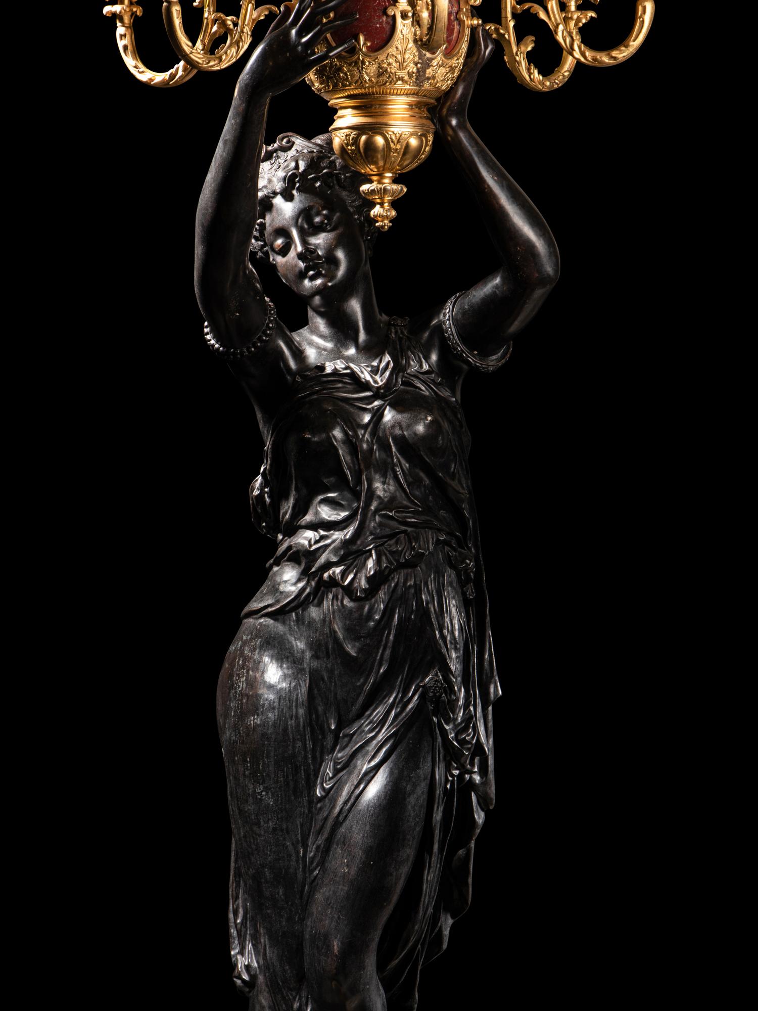 A Pair of Monumental Gilt and Patinated Bronze and Rouge Marble Figural Torchères