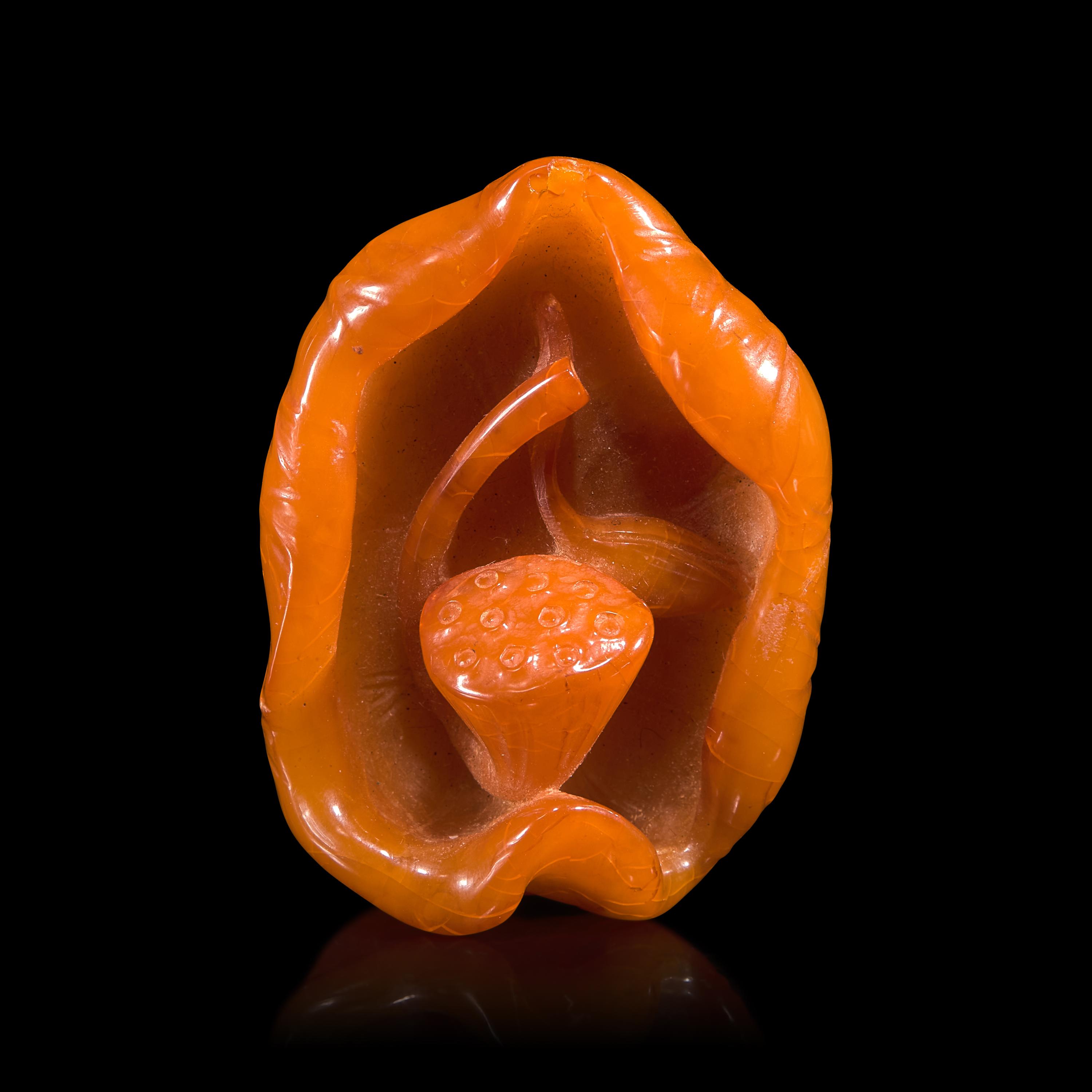 A Chinese 'Beeswax' Amber Lotus Pod and Leaf Pendant — 蜜蠟雕荷葉蓮蓬墜