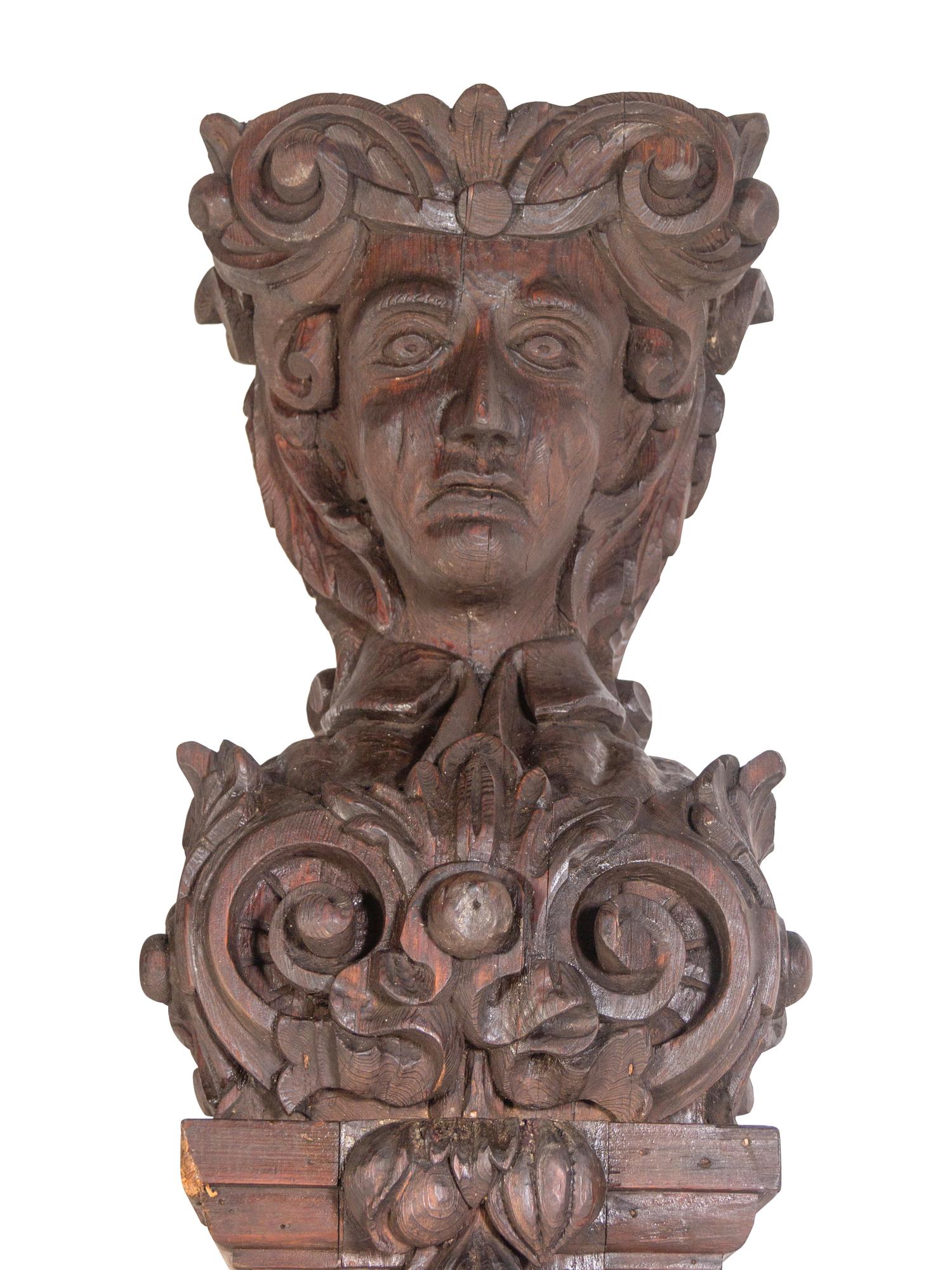 A Pair of Continental Carved Oak Figural Pilasters