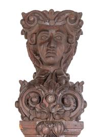 A Pair of Continental Carved Oak Figural Pilasters