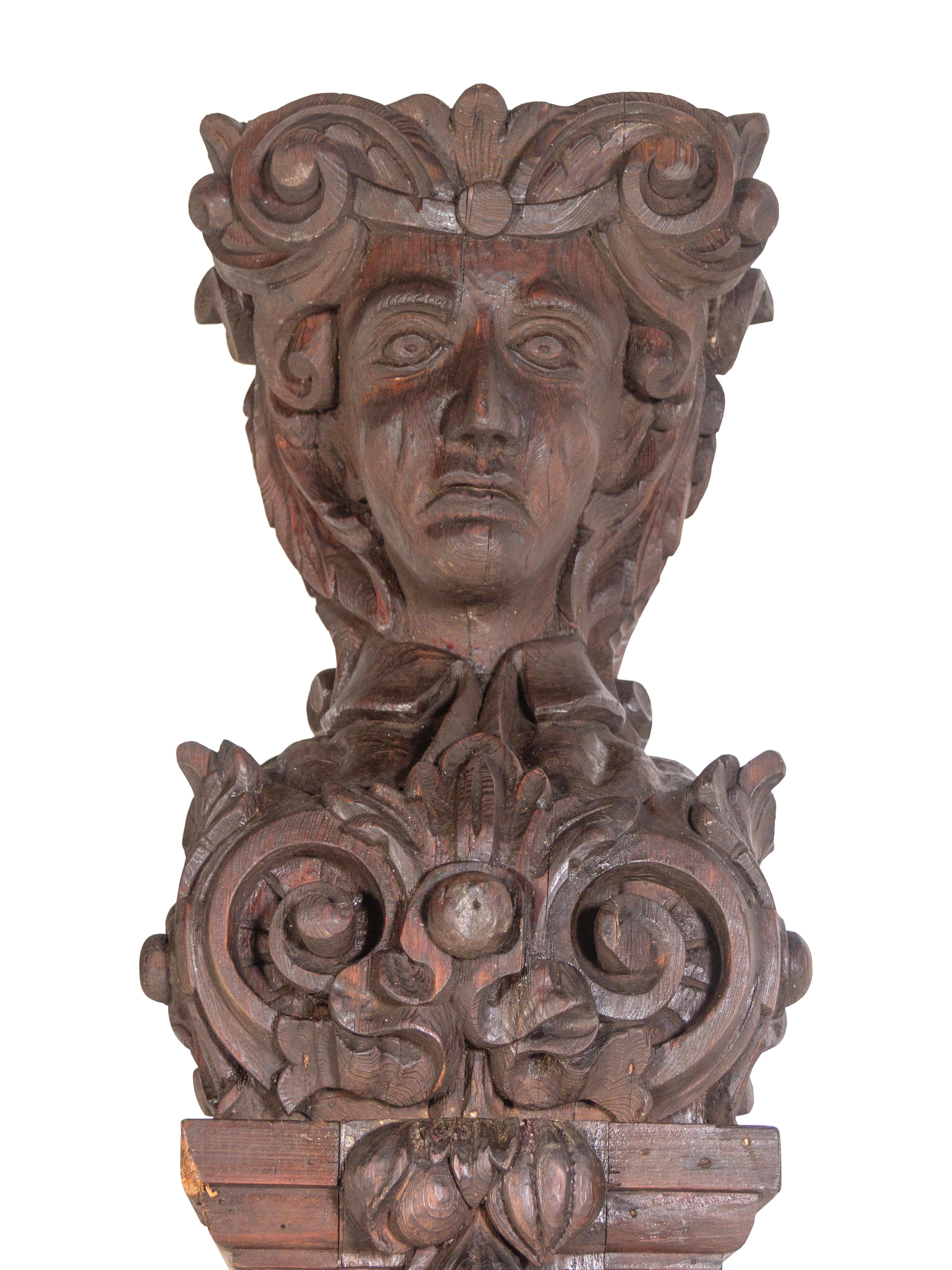 A Pair of Continental Carved Oak Figural Pilasters
