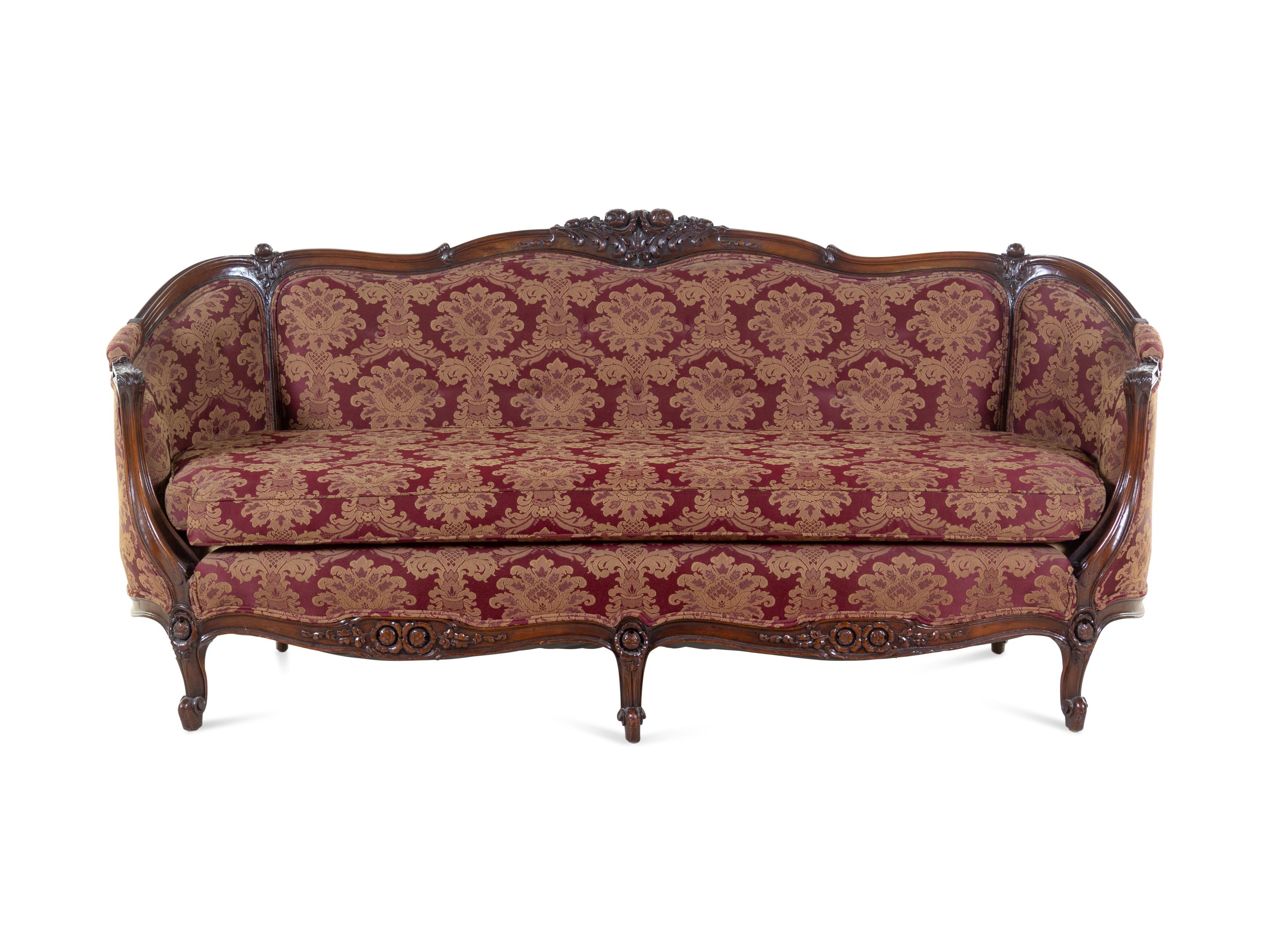 A Rococo Revival Carved Walnut Sofa