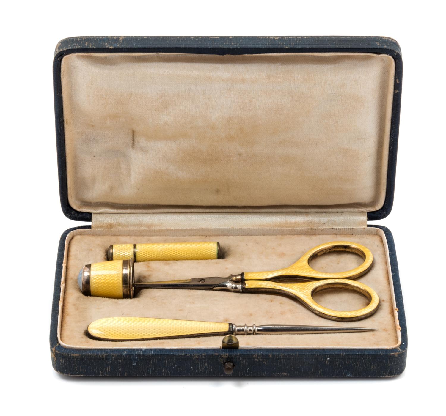 A German Silver and Guilloche Enamel Four-Piece Sewing Kit, , comprising scissors, a thimble, a stiletto and a needle case, each item w