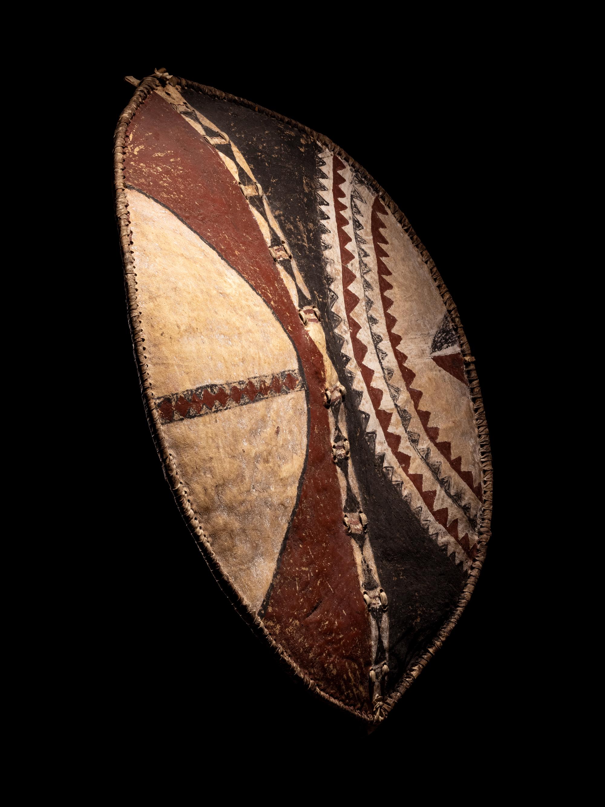 A Maasai Painted Hide Shield and Milk Gourd