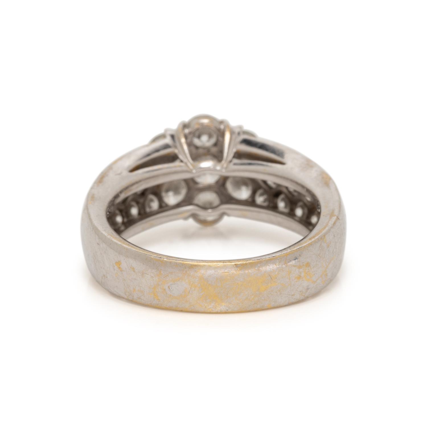VAN CLEEF & ARPELS, WHITE GOLD AND DIAMOND 'FLEURETTE' RING