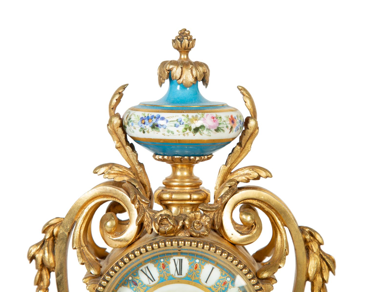 A French Gilt Bronze and Sèvres Porcelain Clock Garniture