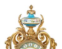 A French Gilt Bronze and Sèvres Porcelain Clock Garniture