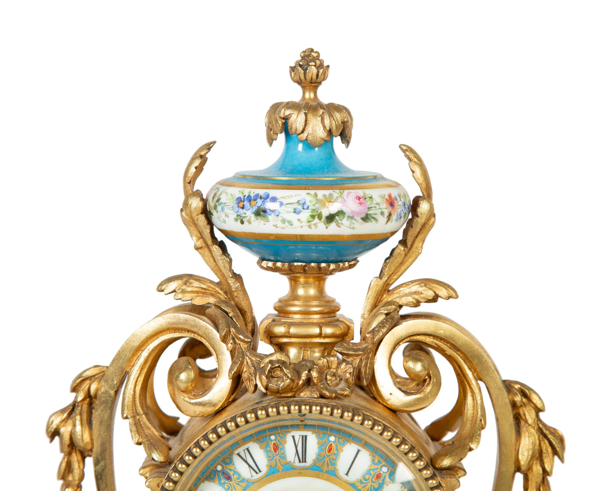 A French Gilt Bronze and Sèvres Porcelain Clock Garniture
