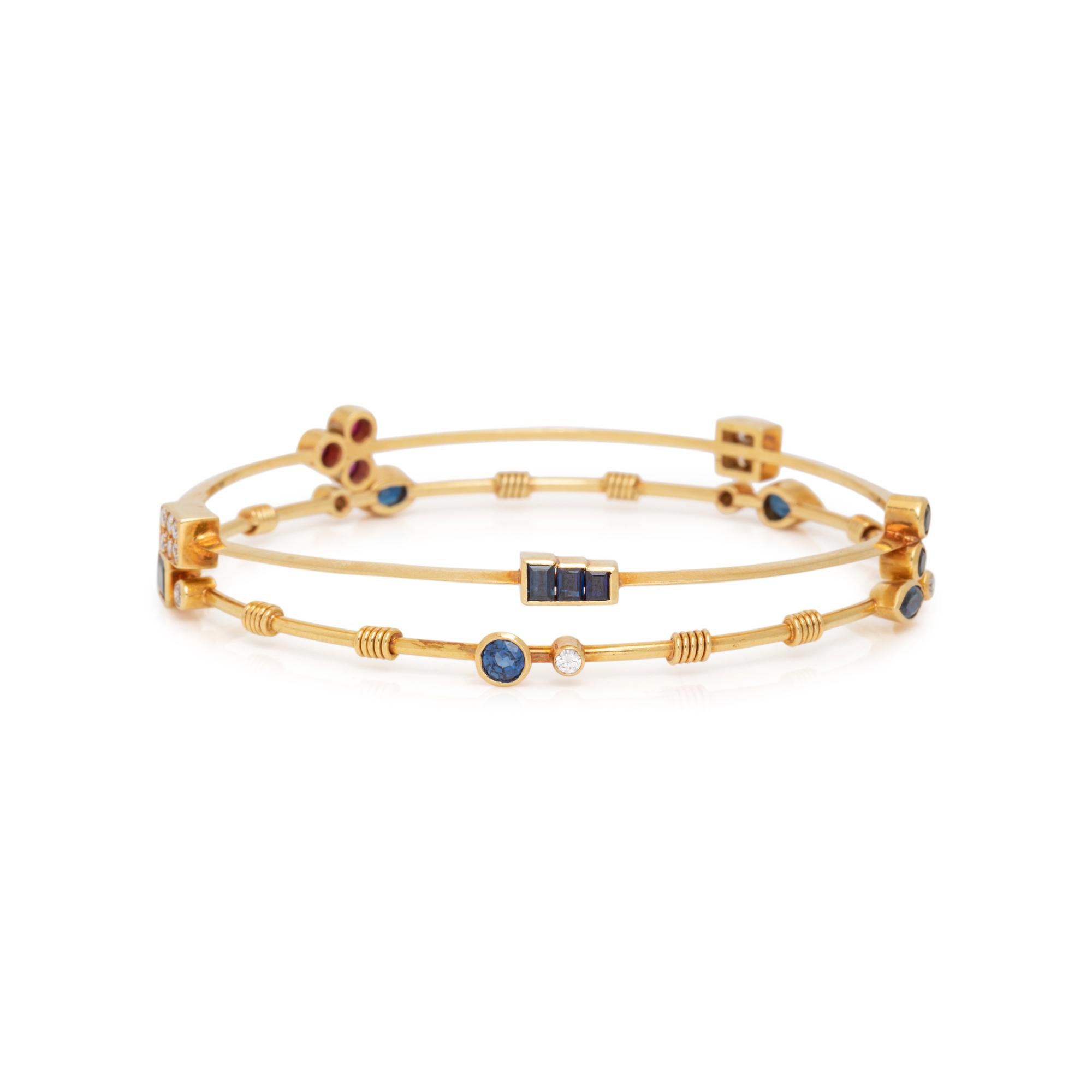 COLLECTION OF YELLOW GOLD, DIAMOND AND GEMSTONE BANGLE BRACELETS