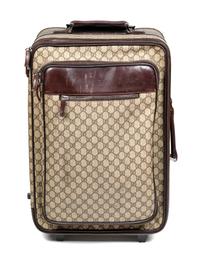 A Gucci Monogram Canvas Roller Suitcase, 22" H x 15.25" W x 9.25" D; Handle: 1.25".