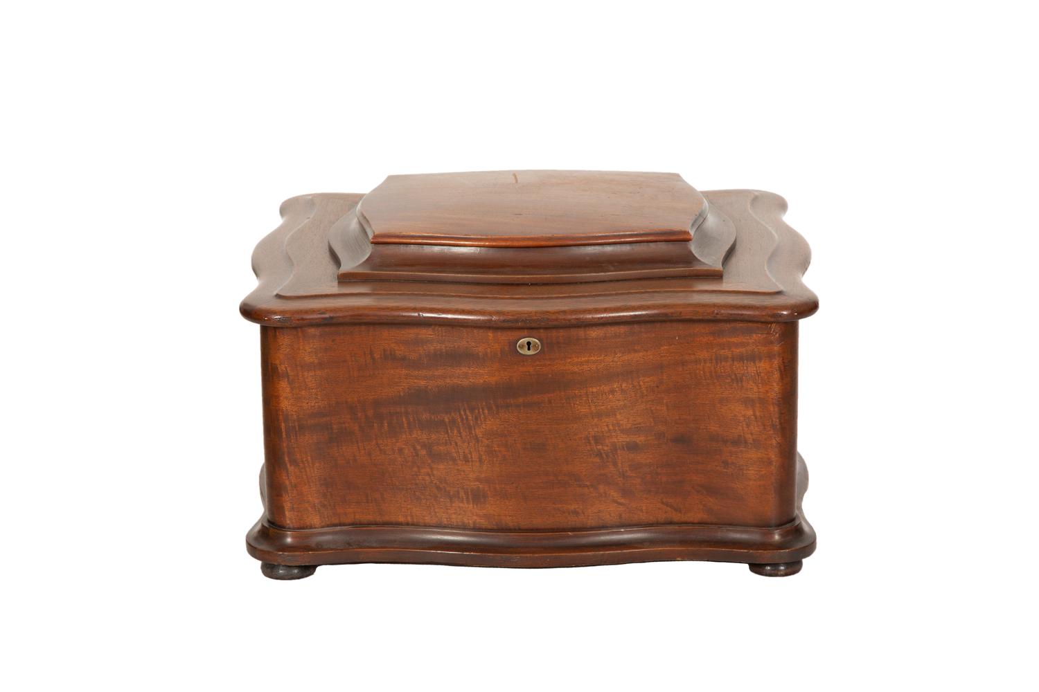 A Regina Mahogany Serpentine Cabinet Music Box