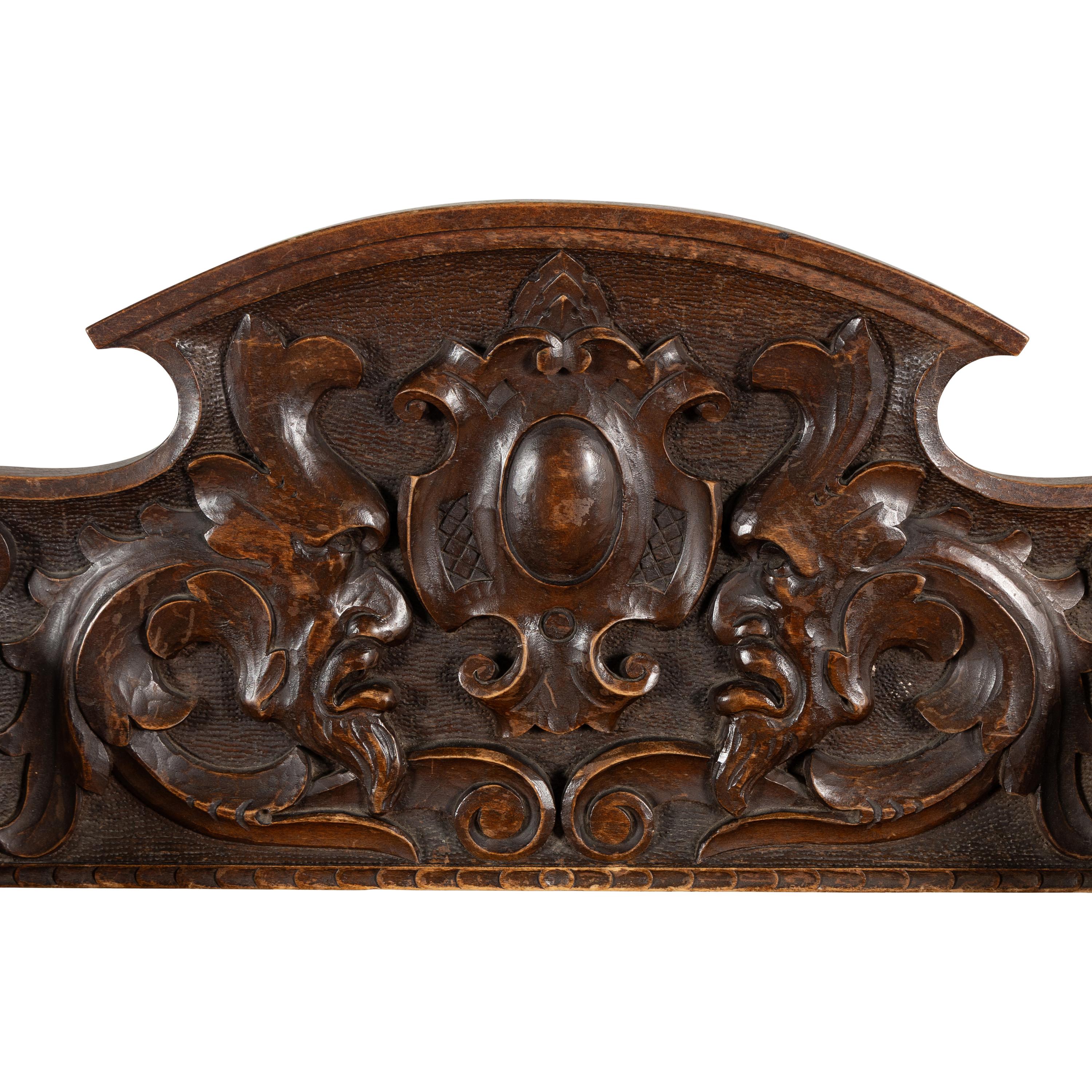 A Pair of Italian Carved Walnut Savonarola Chairs