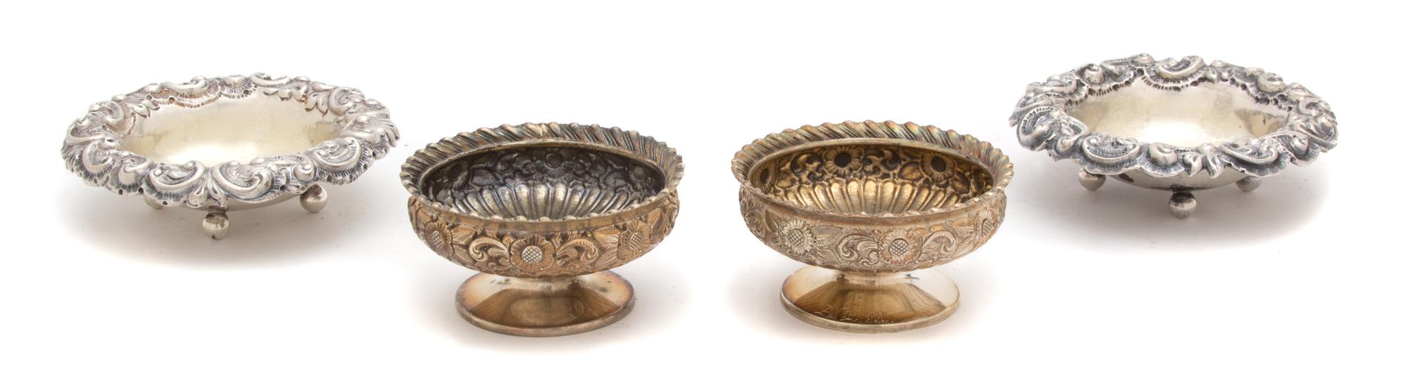 Two Pairs of American Silver Footed Salts, J. E. Caldwell, Philadelphia, PA, one pair with gadrooned rim, the other with chased scroll