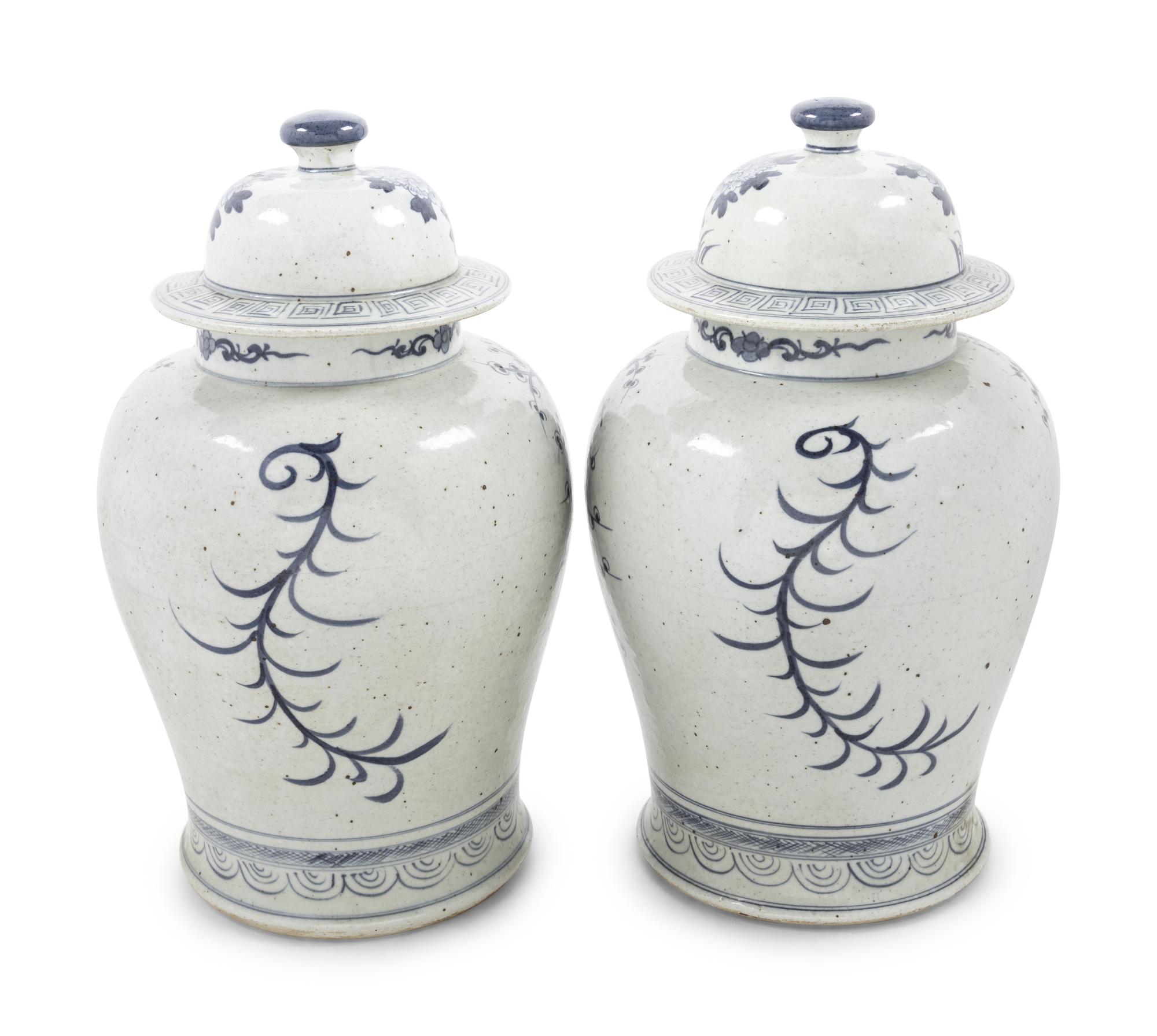 Two Pairs of Chinese Blue and White Porcelain Jars and Covers