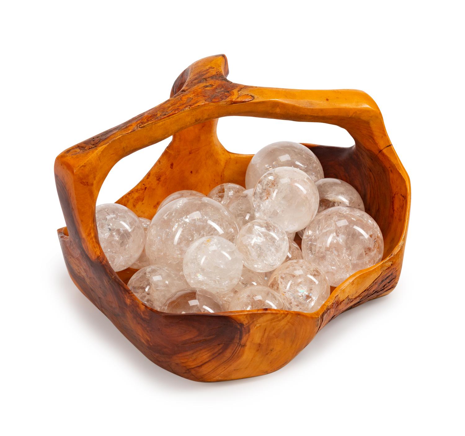 A Continental Carved Wood Basket with Eighteen Rock Crystal Spheres