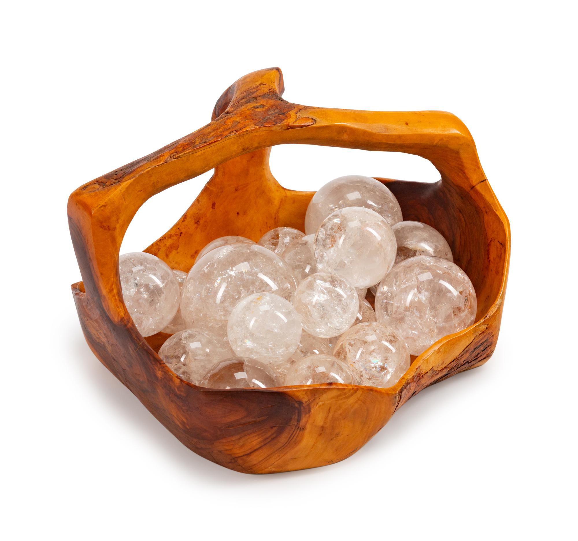 A Continental Carved Wood Basket with Eighteen Rock Crystal Spheres