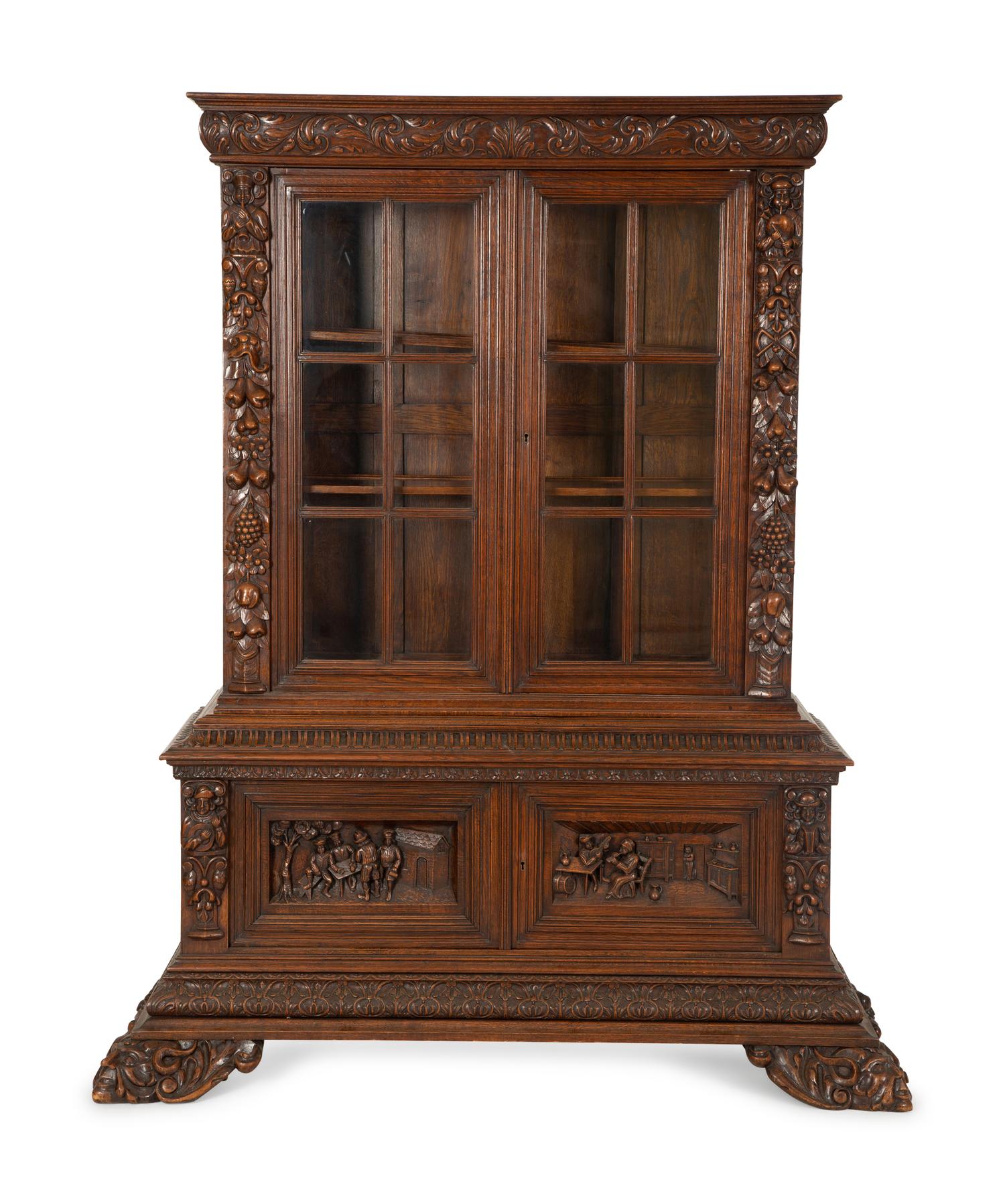 A German Black Forest Carved Oak Bookcase — Late 19th Century
