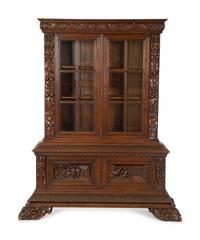 A German Black Forest Carved Oak Bookcase — Late 19th Century