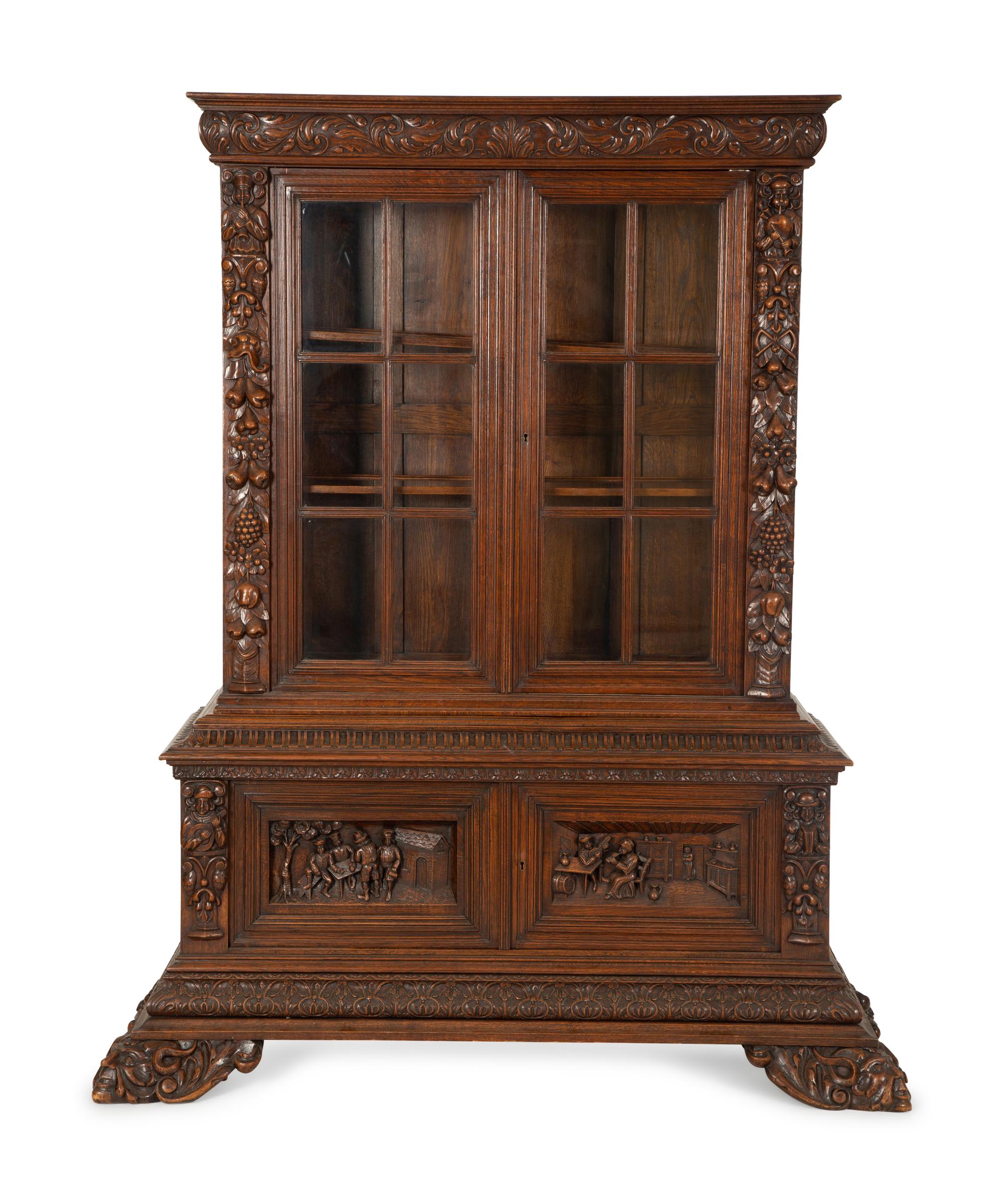 A German Black Forest Carved Oak Bookcase — Late 19th Century