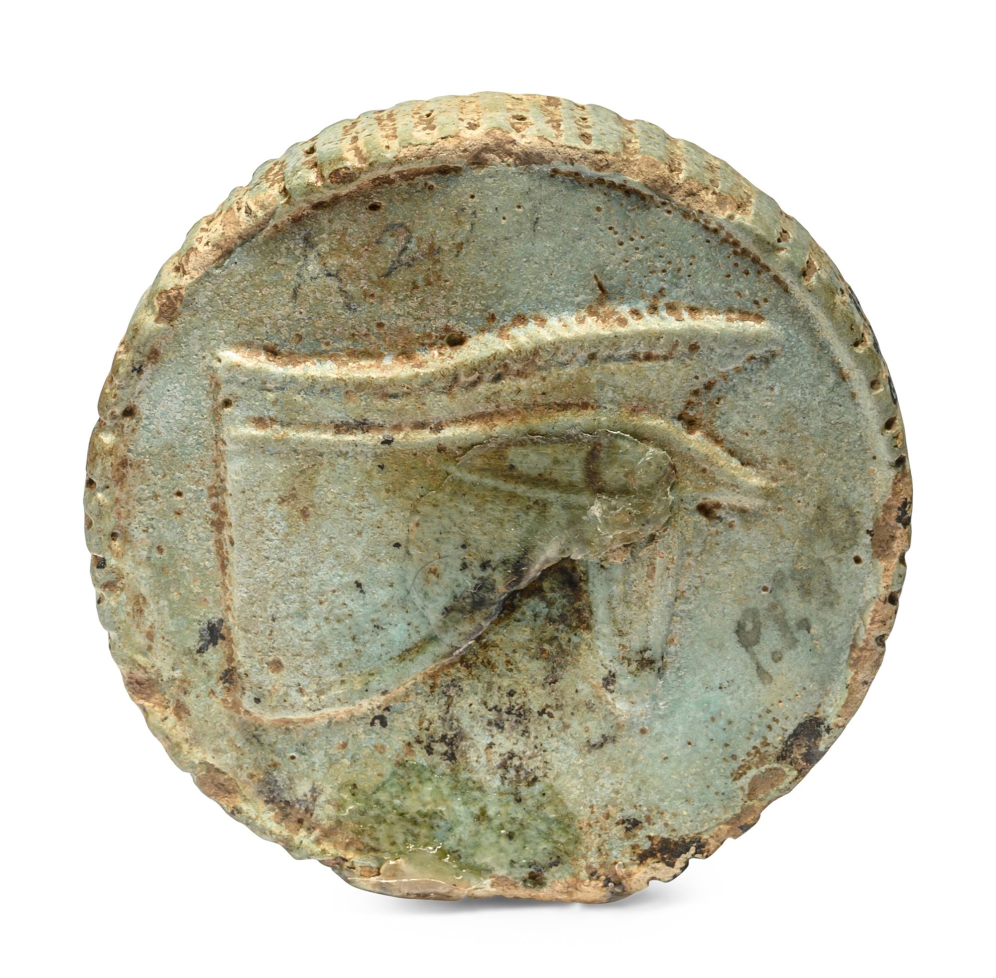 An Egyptian Faience Two-Sided Medallion