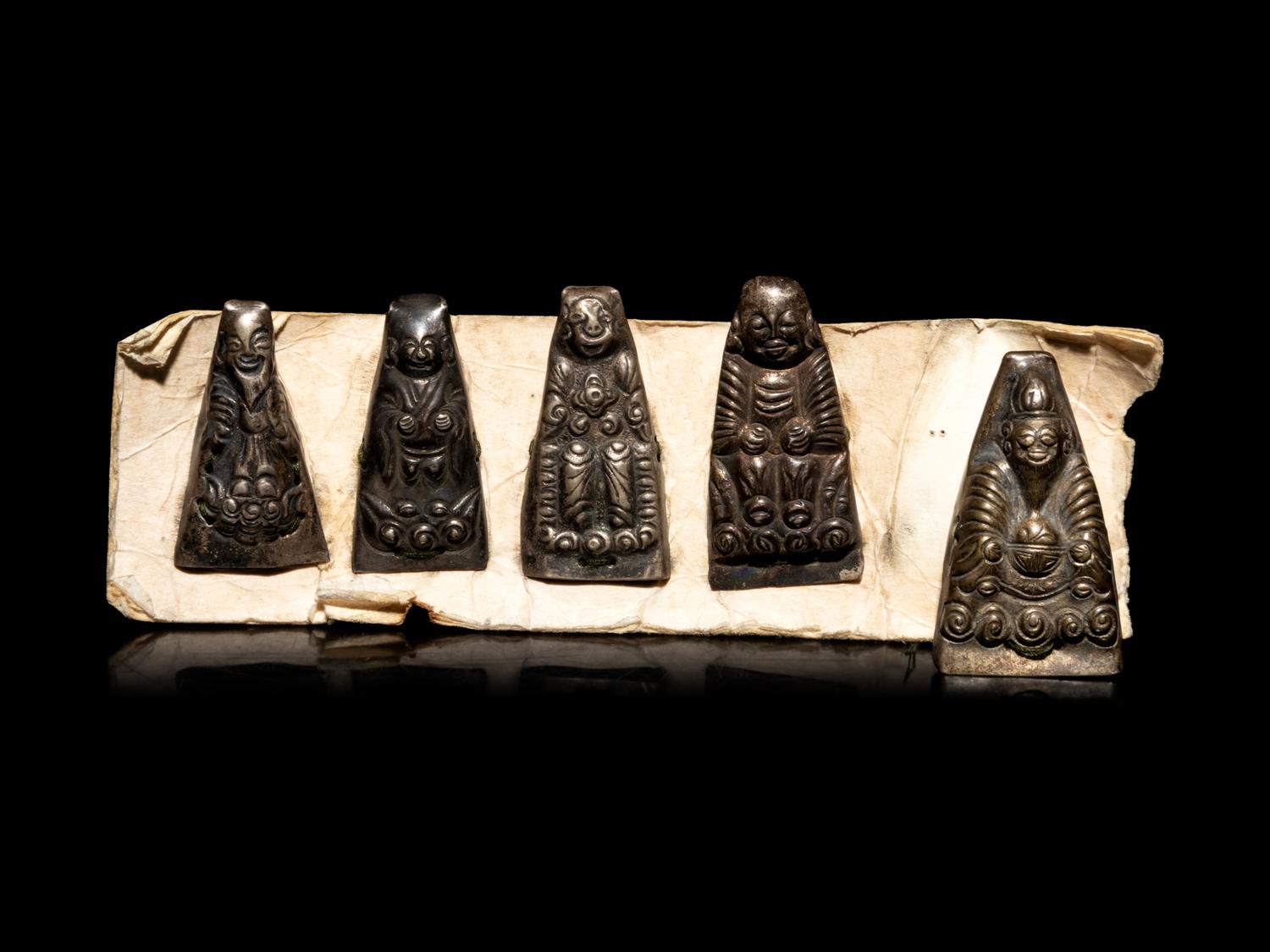 Nine Small Southeast Asian Silver Buddhist Votives