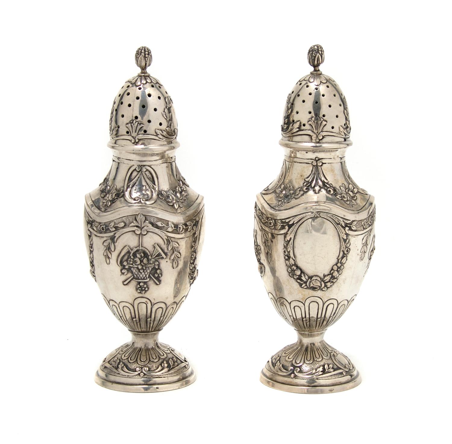 A Pair of Silver Casters, Height 7 inches.