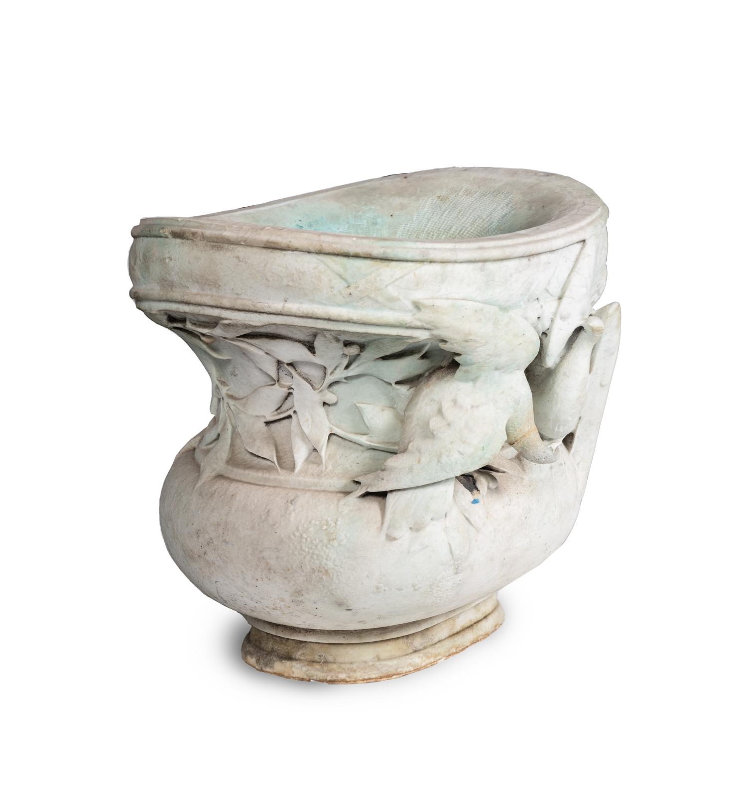 A Carved Variegated Marble Jardinière