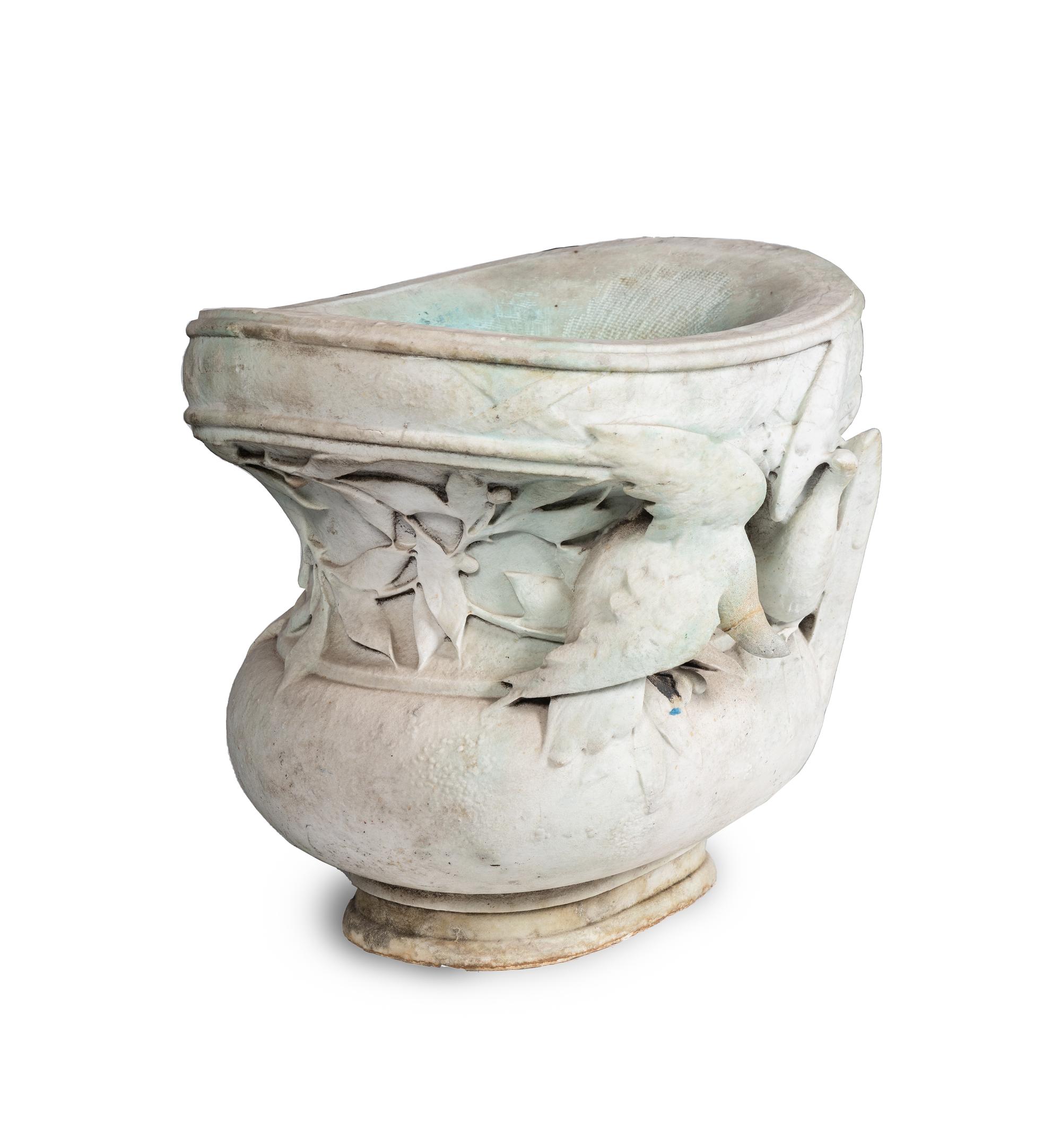 A Carved Variegated Marble Jardinière