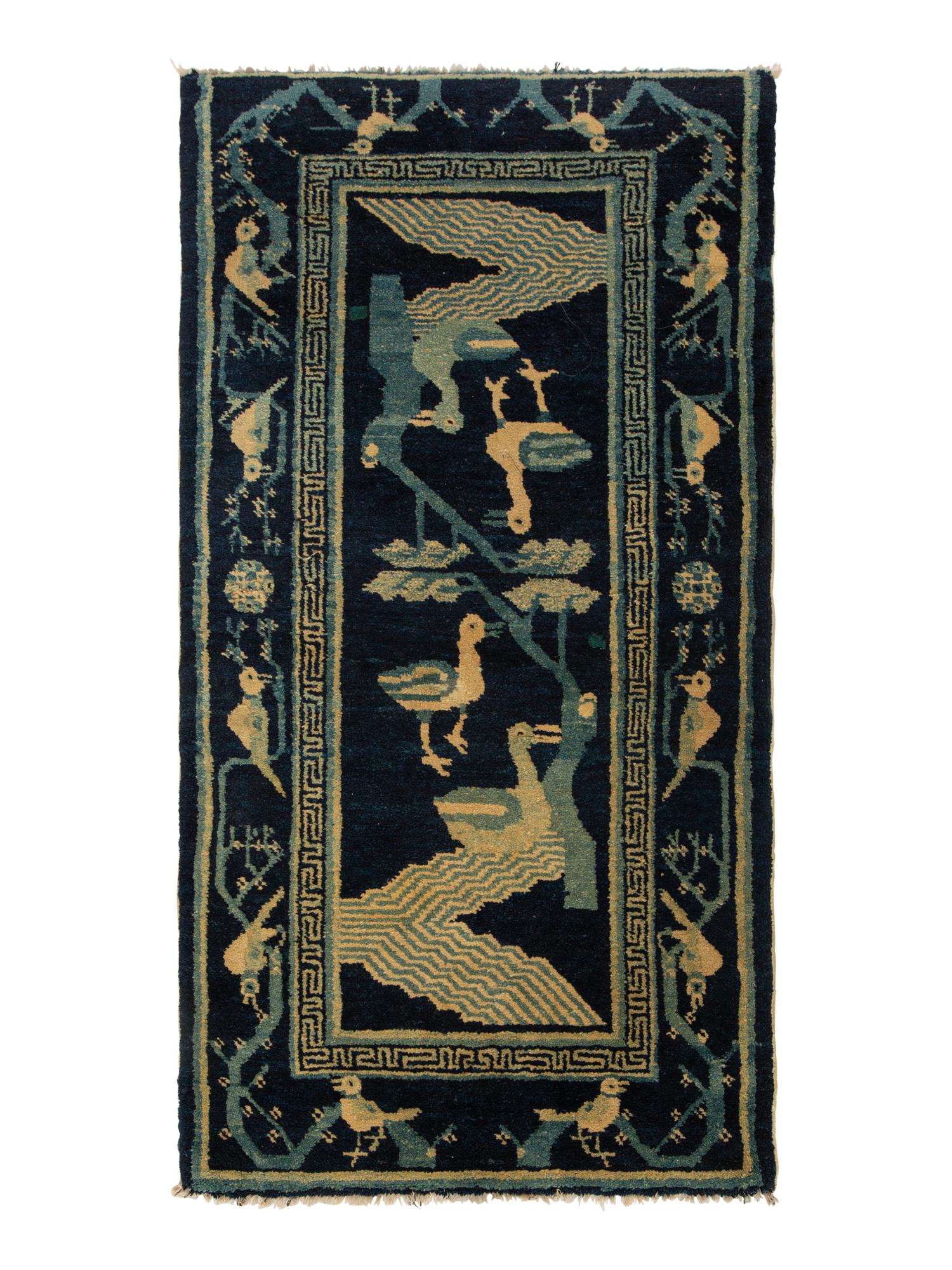 A Group of Four Chinese Rugs