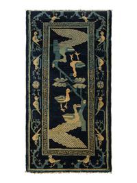 A Group of Four Chinese Rugs