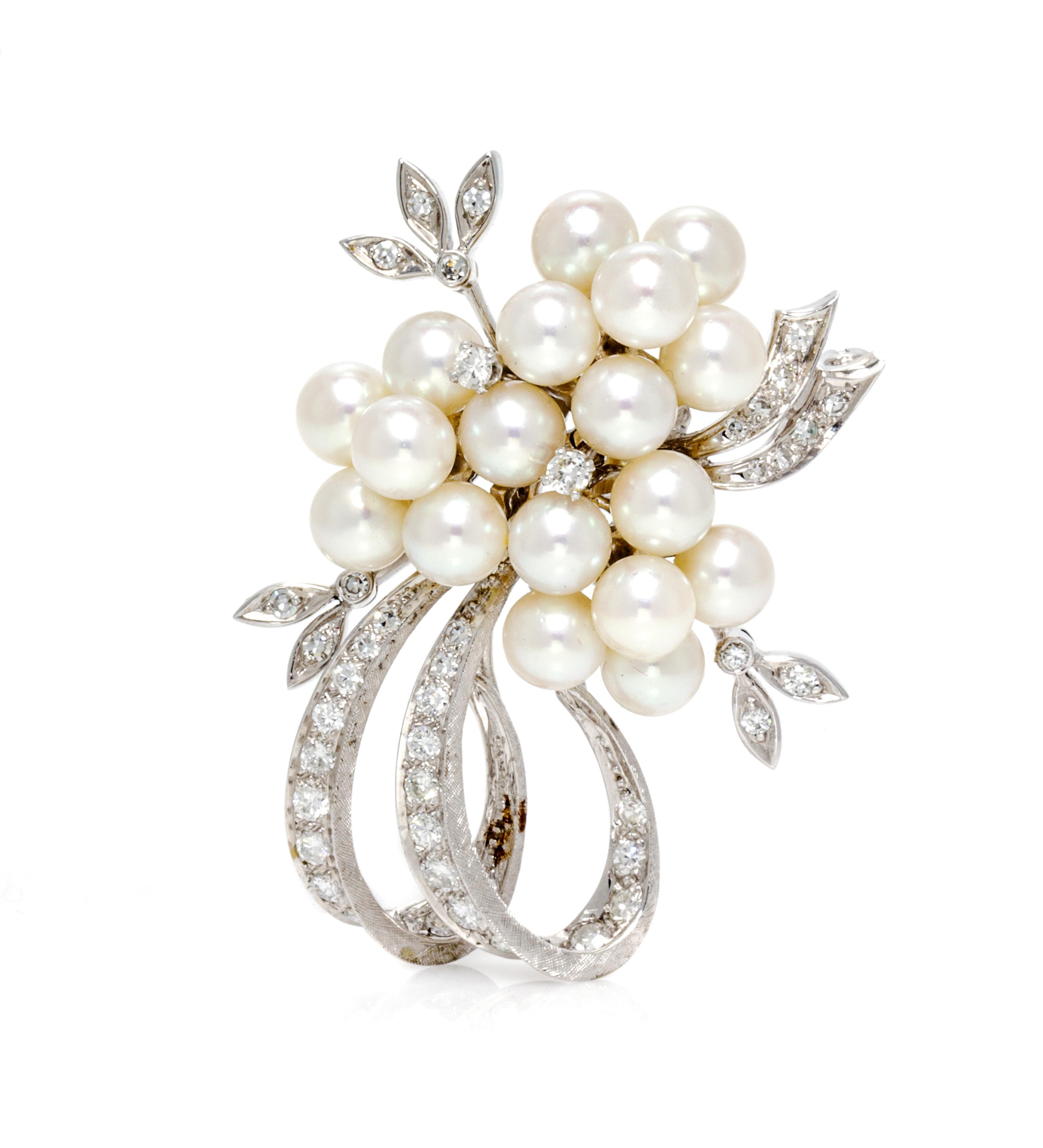 A White Gold, Cultured Pearl and Diamond Spray Brooch, 11.00 dwts.