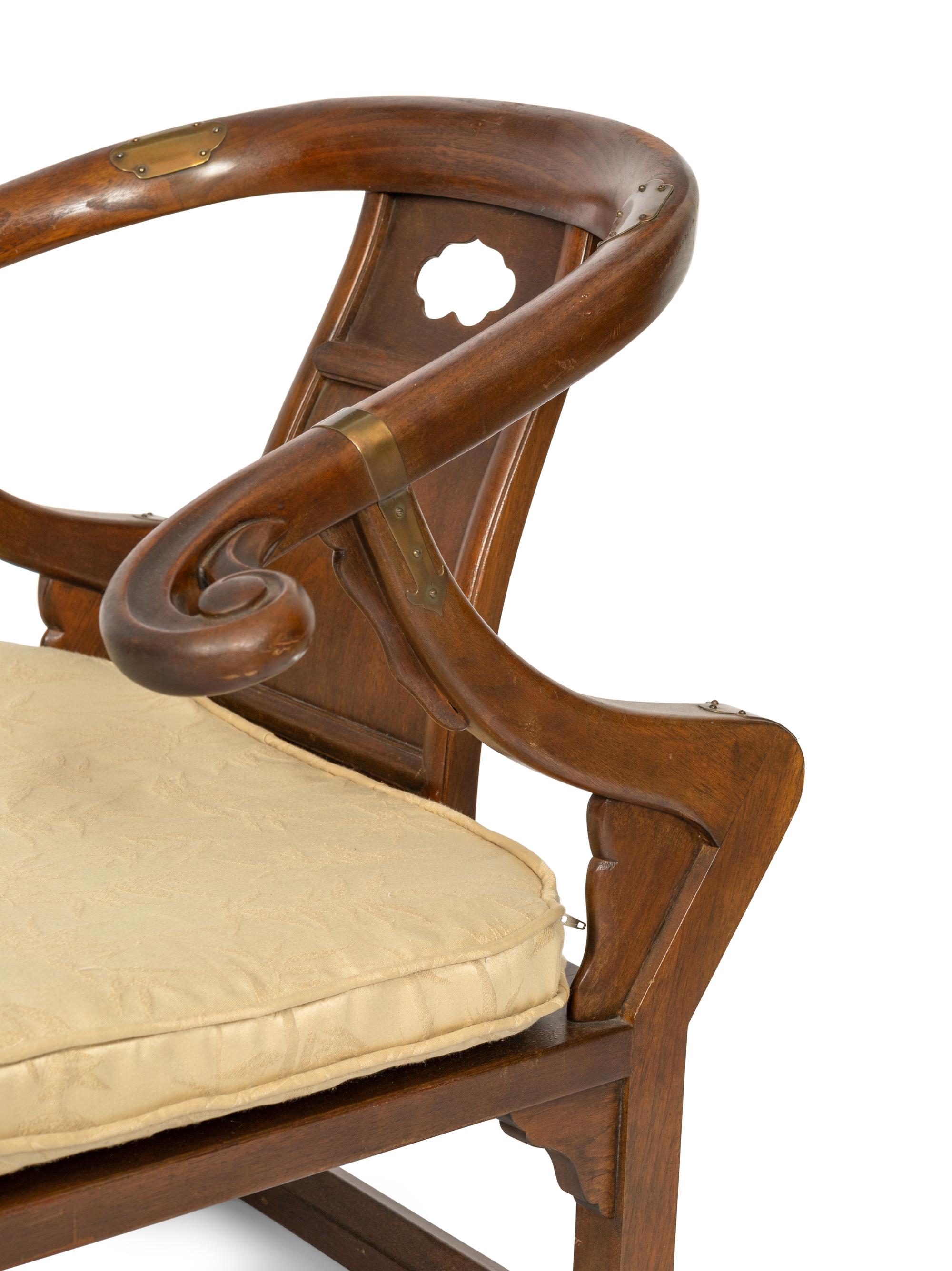 A Pair of Baker Furniture Walnut Horseshoe Back Chairs