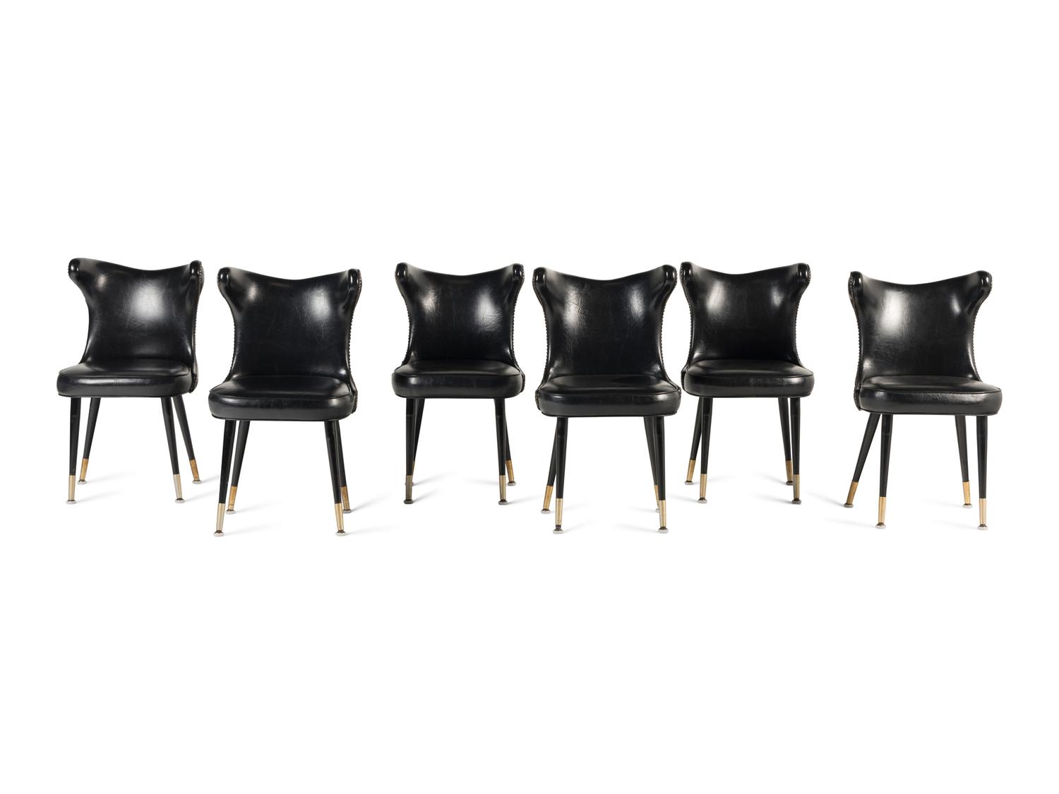 A Set of Six Leather-Upholstered Wingback Chairs
