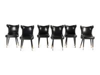 A Set of Six Leather-Upholstered Wingback Chairs