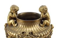 A French Gilt Bronze and Specimen Marble Three-Piece Clock Garniture