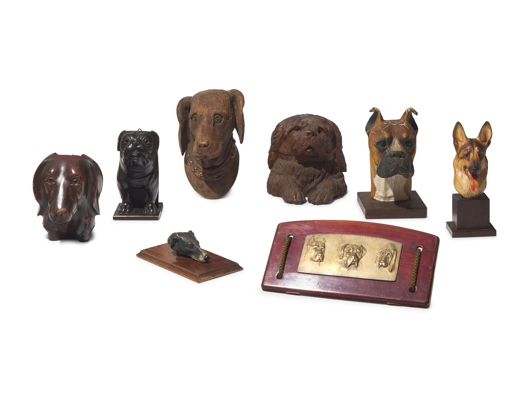 A Collection of Eight Dog-Form Carved Wood, Cast Plaster or Composite, and Cast Metal Articles