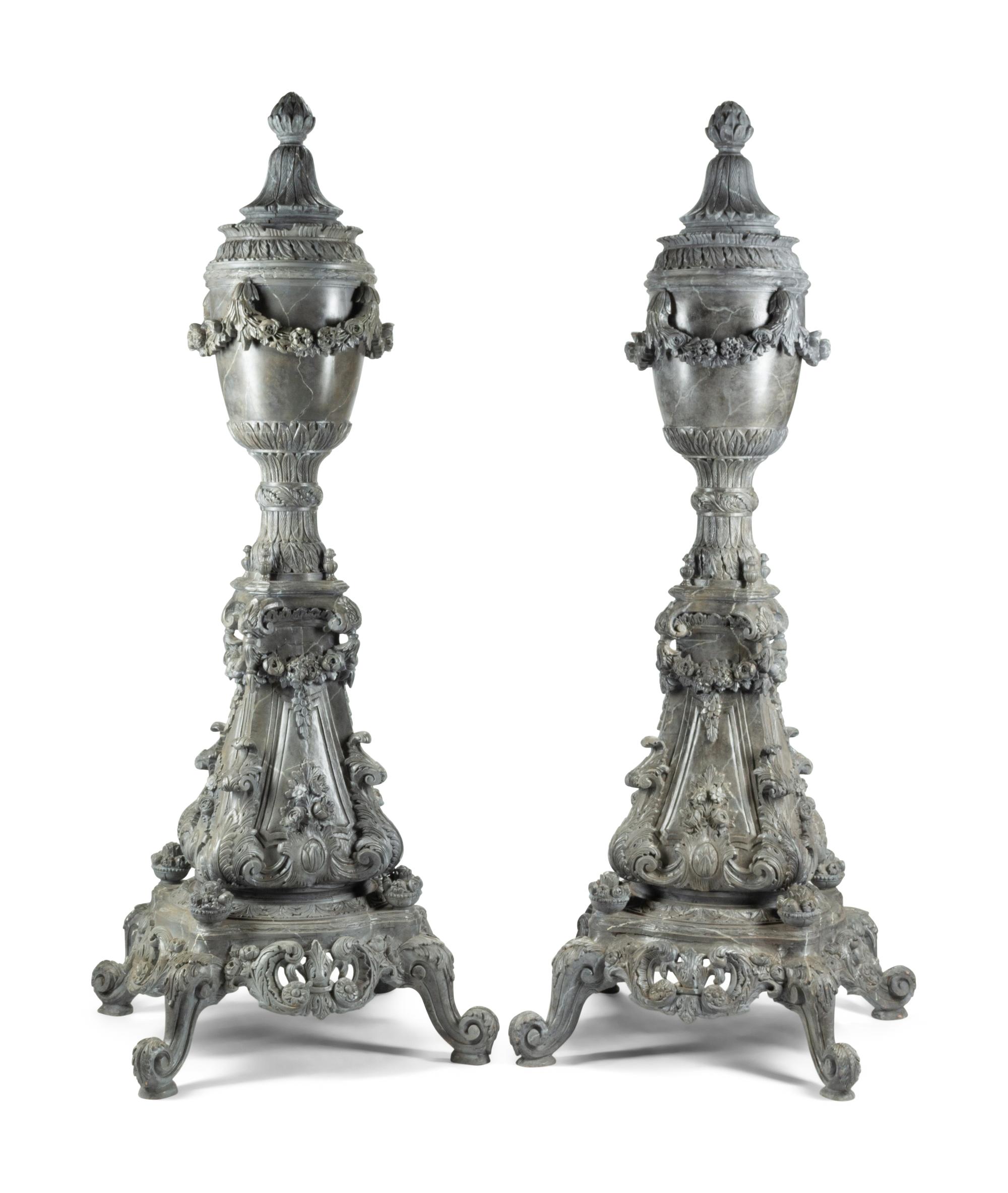 A Pair of Monumental Italian Carved and Faux Marble Painted Urns on Stands
