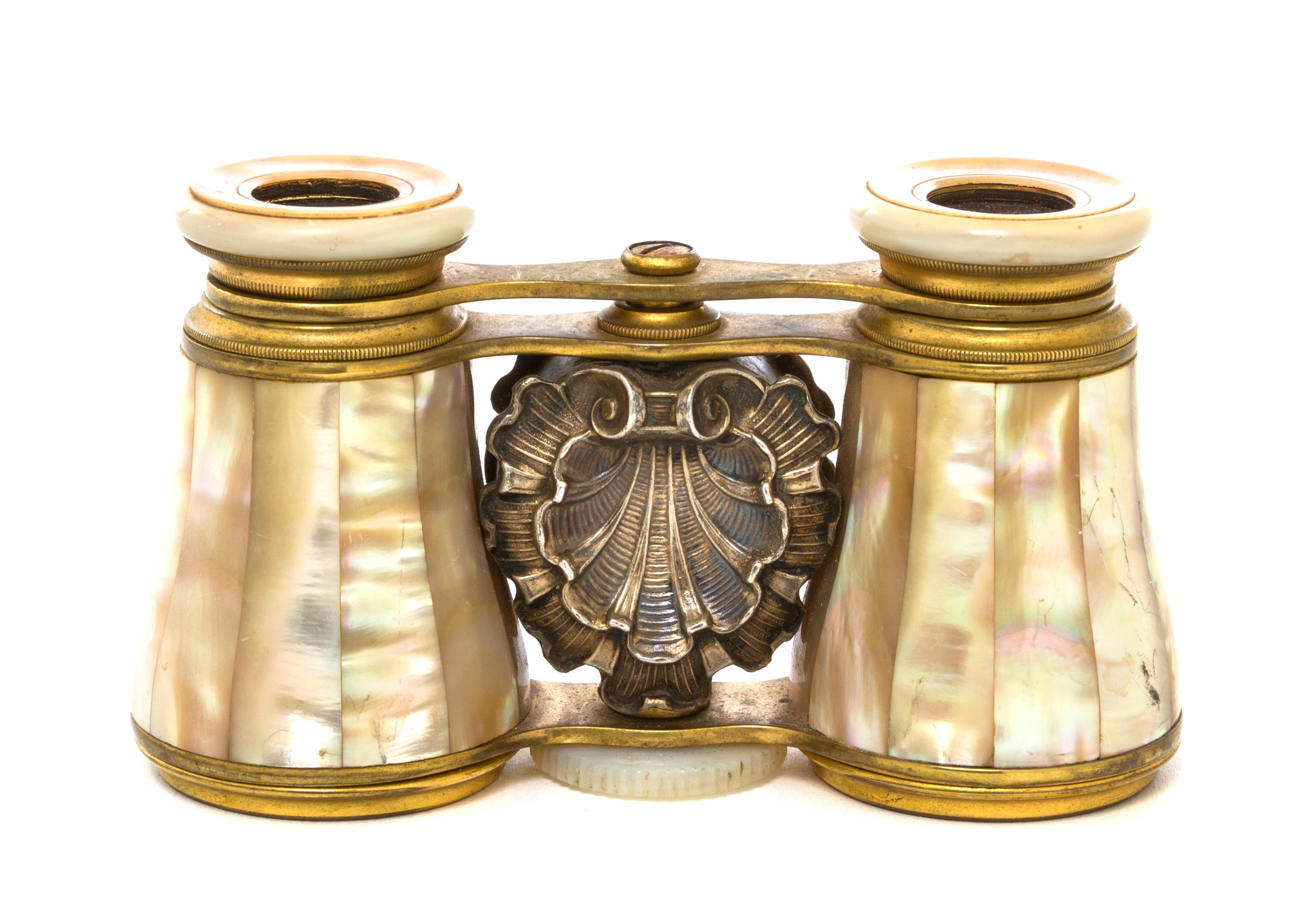 A Pair of Mother-of-Pearl Veneered and Silver Set Opera Glasses, Width 3 7/8 inches.