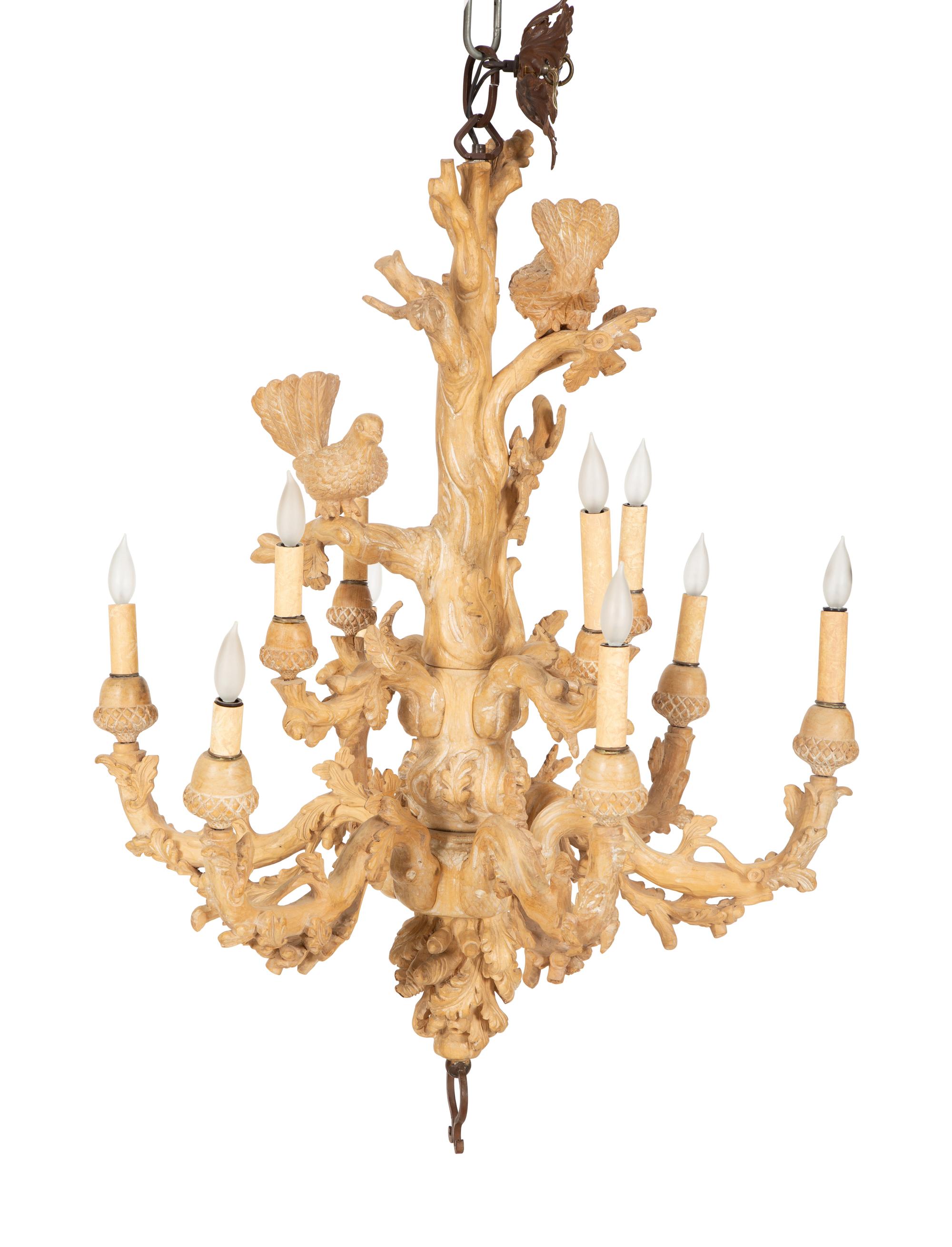 A Carved Fruitwood Ten Light Chandelier