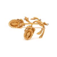 CARL D. LINDSTROM, YELLOW GOLD AND DIAMOND BROOCH