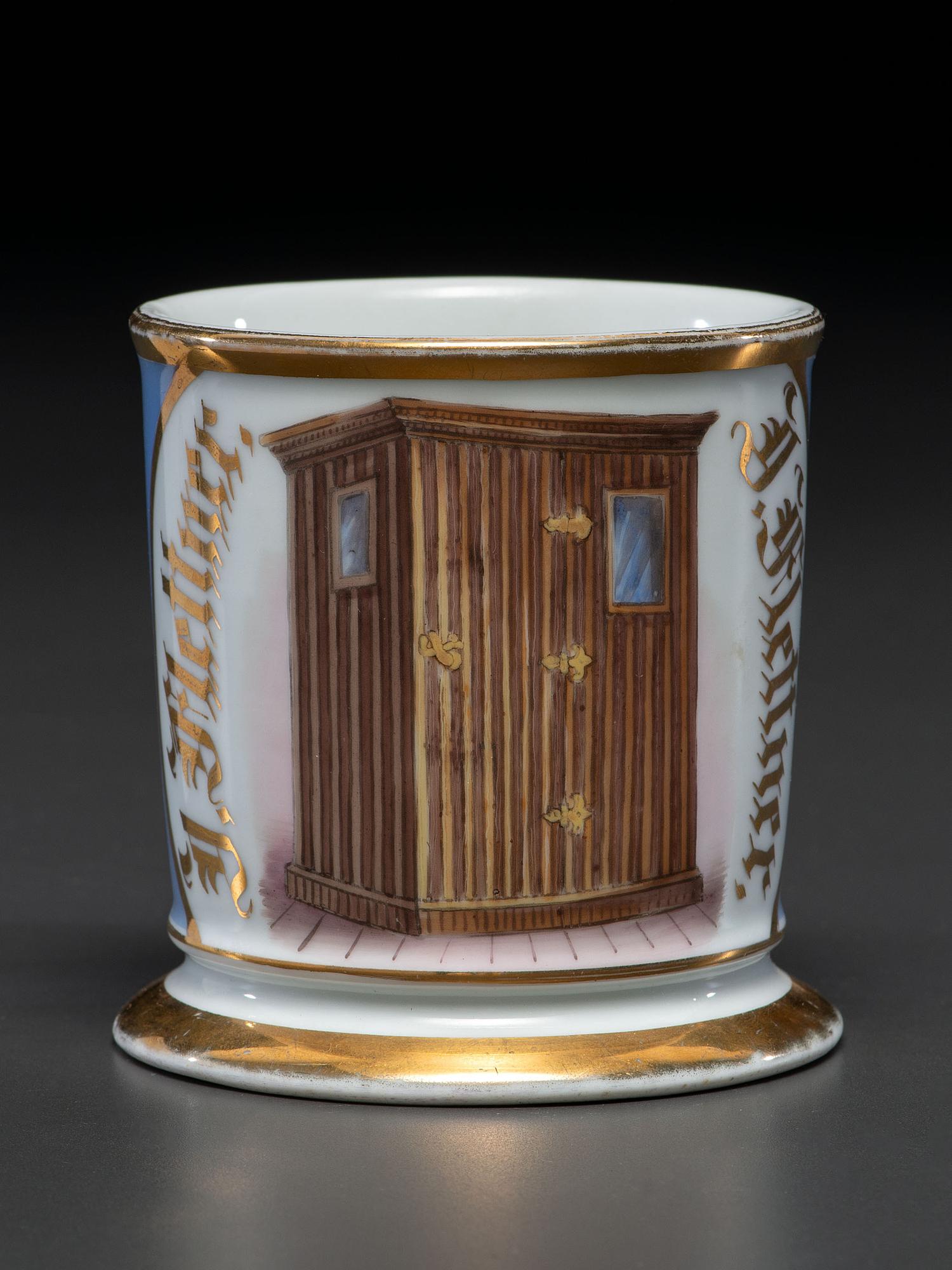 An Unusual Porcelain Shaving Mug Depicting an Icehouse